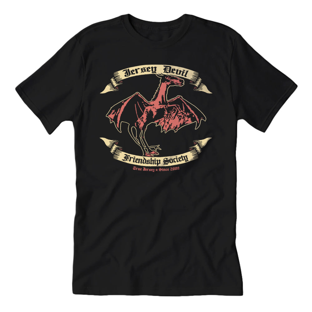 Black T-shirt featuring a graphic of the Jersey Devil with the text 'Jersey Devil Friendship Society' on it.